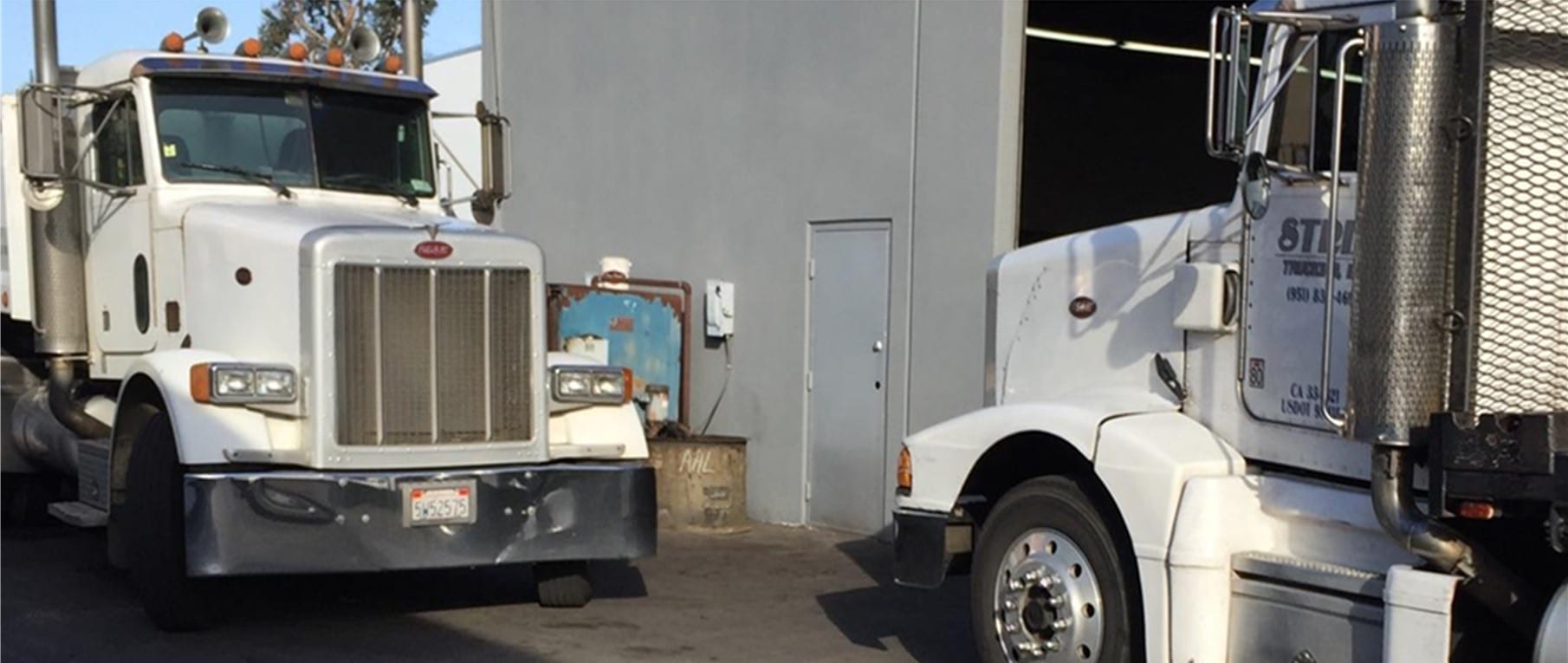 Semi trucks parked at the OC Transmission and Differential shop